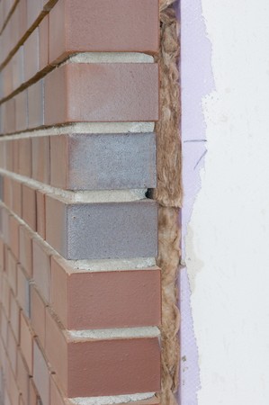 Thermal insulation of a house wall on a construction site