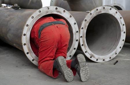 Worker checks a steel pipeのeditorial素材