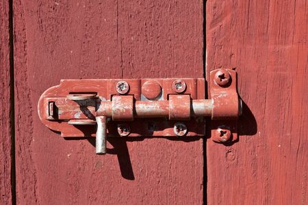 The door is locked with a sliding lockの写真素材