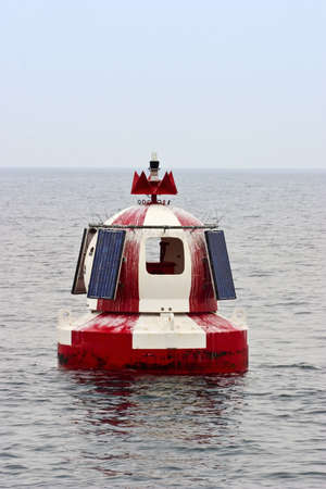 Buoy vith sun panels at the coast