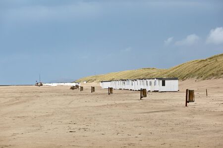 A long row of beach hutsの写真素材