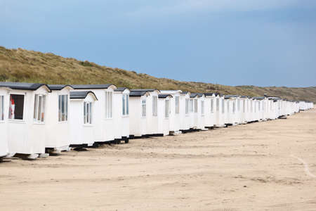 A long row of beach hutsの写真素材