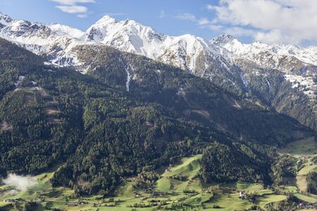 View of valley and mountains in the Alpsの写真素材