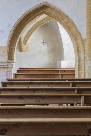 Benches and arch in the churchの写真素材