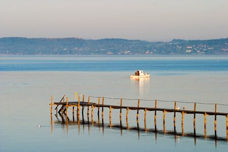 Pleasure boat fishing in the bayの写真素材