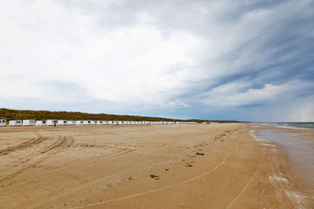 A long row of beach huts