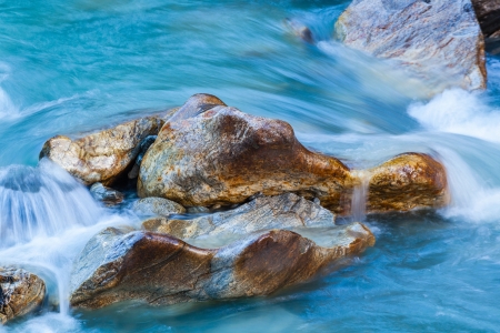 Rocks in flowing riverの写真素材