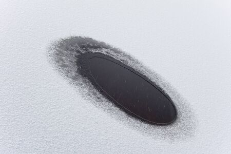 Melted water puddle on the lakeの写真素材