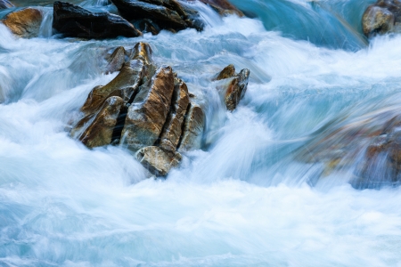 Rock in a rapid riverの写真素材