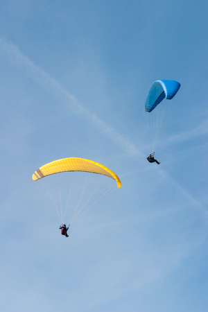 Paragliding on the blue skyの写真素材
