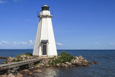 Wooden lighthouse by the lakeの写真素材