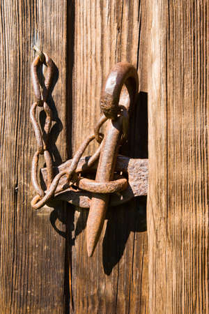 Weathered wooden door with forgin locksの写真素材