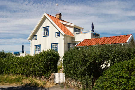 Wooden house with a big hedgeのeditorial素材