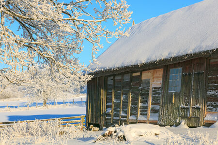 Old barn in winter landscapeのeditorial素材