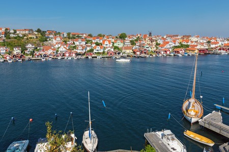 Fiskebackskil with sailboats at the jetty on swedish west coastの写真素材