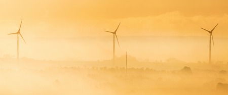 Wind turbines in the dawn lightの写真素材