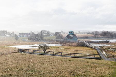 Snowfall in the spring at the visit center Naturum at Lake Hornborga in Swedenの写真素材