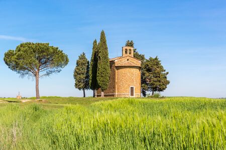 Chapel on a hill in a cornfieldの写真素材