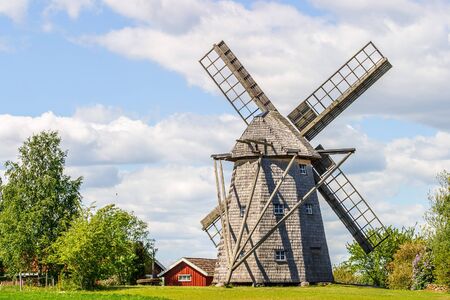 Windmill at a farm in a rural landscapeの写真素材