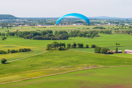 Rural Swedish landscape with a paragliderの写真素材