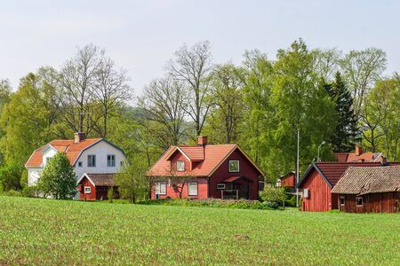 House in a newly seeded field in the countryの写真素材