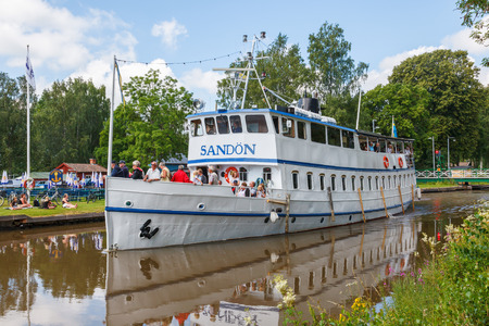 Ship with tourists on gota canal in a beautiful Swedish summer landscapeのeditorial素材