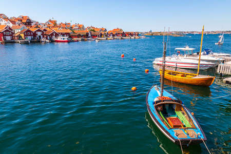 Old wooden boats at a fishing village by the seaの写真素材
