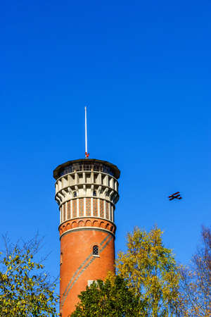 Biplane in the sky at an observation towerの写真素材