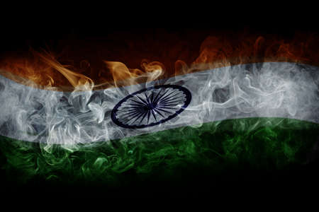 Indian flag with smoke isolated on dark black backgroundの写真素材