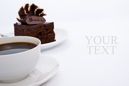 Delicious brownie cake with luxury cream topping and coffeeの写真素材