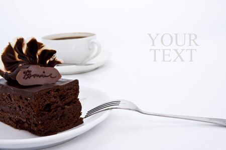 Delicious brownie cake with luxury cream topping and coffeeの写真素材