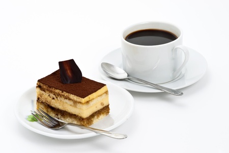 Tiramisu cake on the plate over white background の写真素材