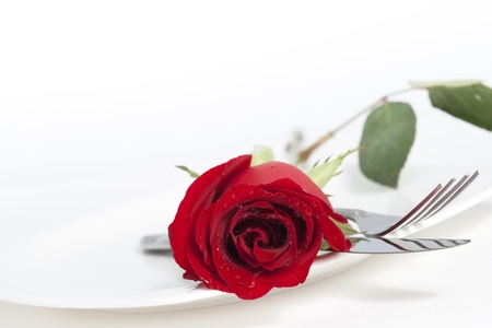 Valentine Series, Red rose and cutlery on white plateの写真素材