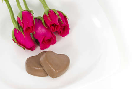 Chocolate heart and rose in the Valentine's Day, white backgroundの写真素材