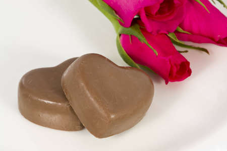 Chocolate heart and rose in the Valentine's Day, white background