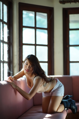 Sexy woman posing in old abandoned house.の写真素材