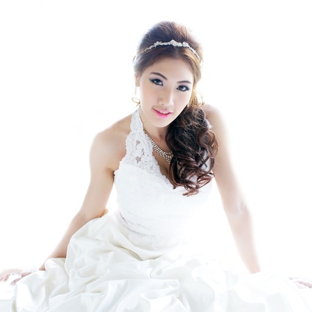 Young Asian lady in white bride dressの写真素材