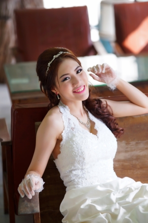 Young Asian lady in white bride dressの写真素材