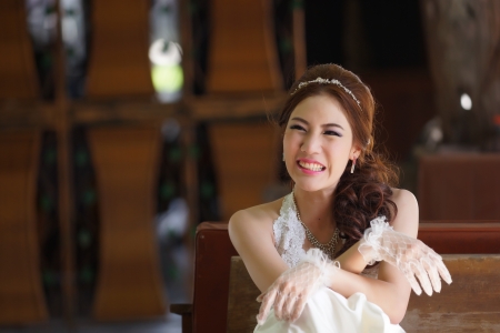 Young Asian lady in white bride dressの写真素材