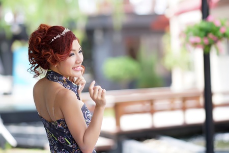 Beautiful young woman stand alone at the outdoor cafe, Model is Thai Ethnicity.の写真素材