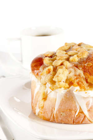 Delicious danish pastry with a cup of black coffee on white background