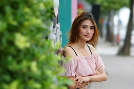 Beautiful young woman posing alone at the outdoor cafe, Model is Thai Ethnicity.の写真素材