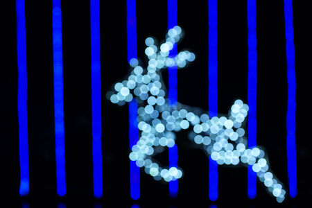 Reindeer Christmas lights as background.の写真素材