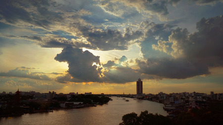 Sunset with big dark clouds on the river at Bangkok, Rain will coming soon. 