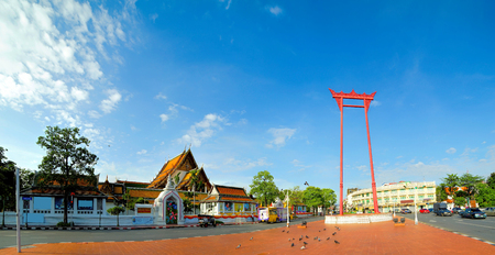 View of sunny morning with beautiful sky at Giant Swing (Sao Ching Cha) and Wat Sutut, Bangkok, Thailand.の写真素材