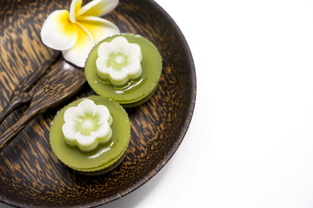 Thai dessert, pandan Jelly serve on palm wood dish. The name of Thai is Woon Bai Toeyの写真素材