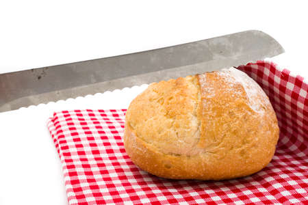 Cutting rustic sourdough bread.