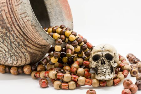 Skull model with Paternoster and pottery.の写真素材