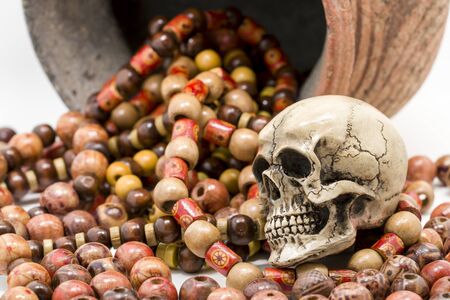 Skull model with Paternoster and pottery.の写真素材