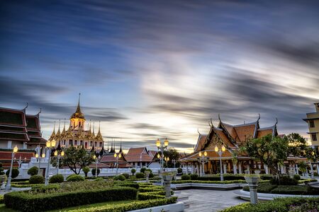 Loha Prasat Metal Palace in Wat ratchanadda, Bangkok, Thailand, clouds motion blur